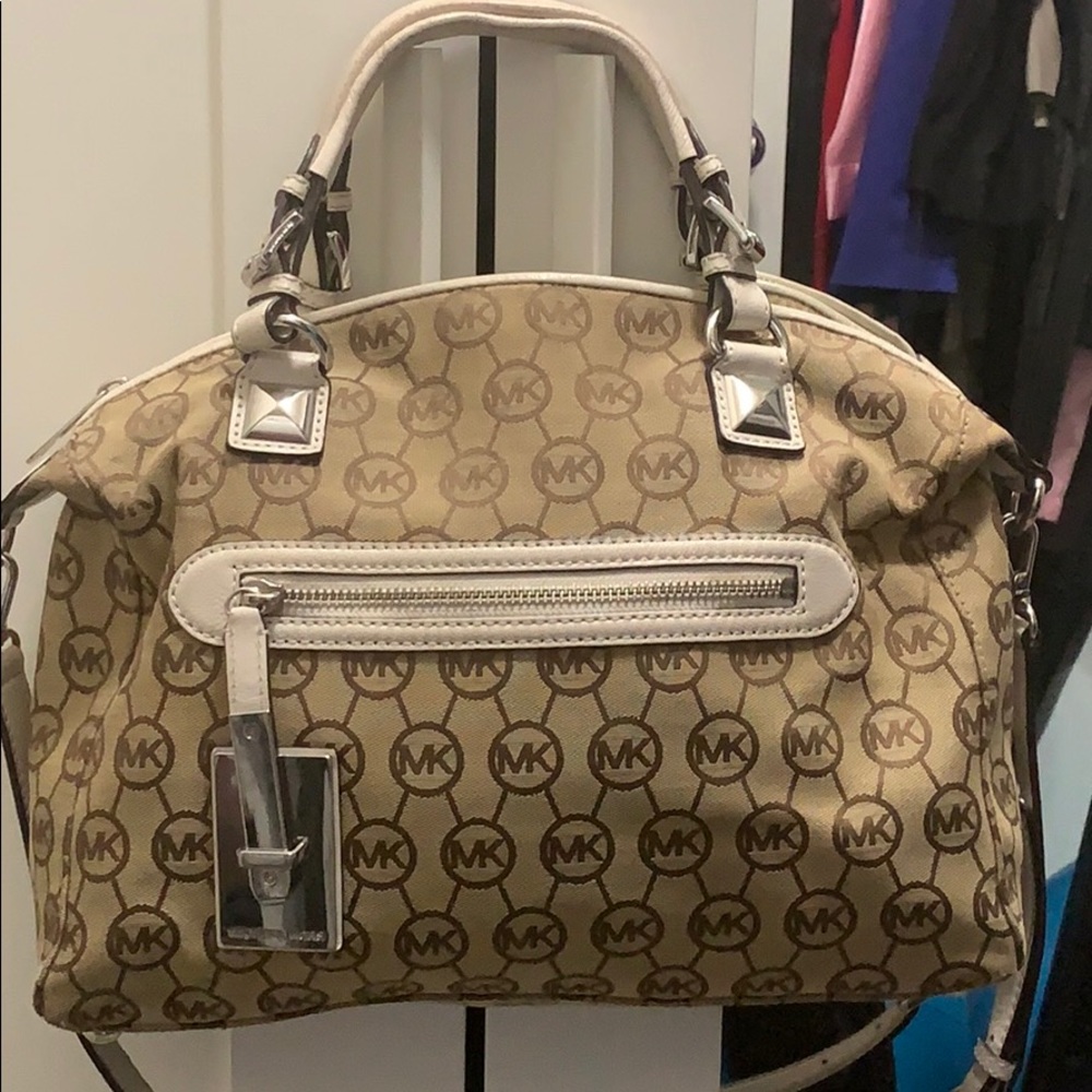 Michael Kors tan and white purse.
